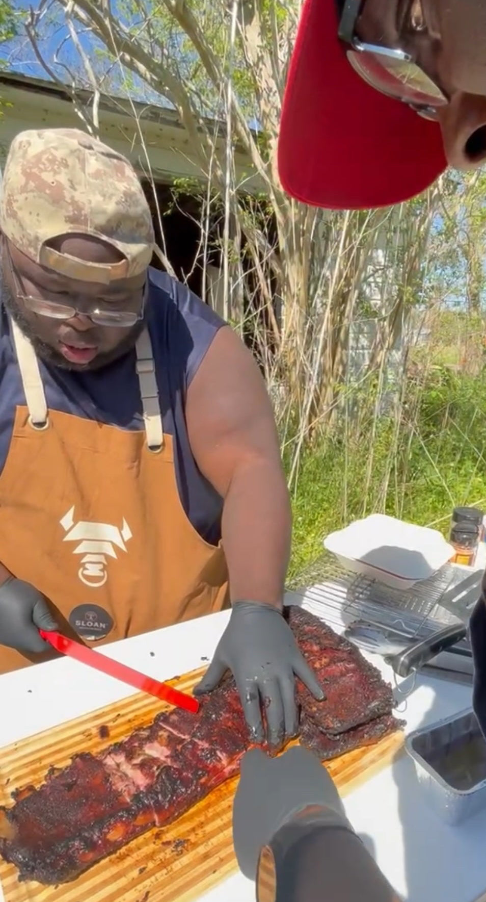 The Pit Specialist in Sloan Seasonings Apron BBQ ribs QitUP Texas
